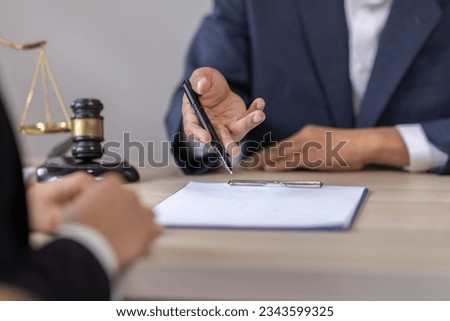 Business Asian people and lawyers, Businessman and lawyer discuss the contract document. Judge gavel deciding on marriage divorce signing papers. lawyer concept.