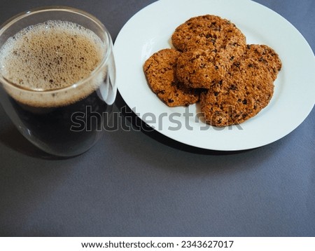 homemade oatmeal cookies with chocolate and coffee on isolate