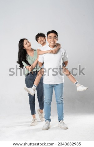 a family posing on a white background Royalty-Free Stock Photo #2343632935