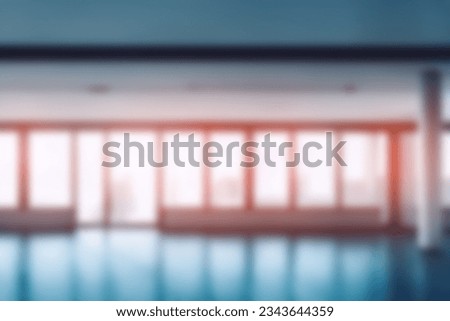 On the blurred background of the empty office room