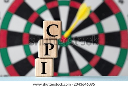 CPI - acronym on wooden cubes on dartboard background. Business and CPI, consumer price index concept. Royalty-Free Stock Photo #2343646095