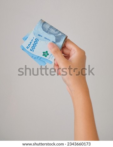 Woman Hand Hold New Rupiah Indonesian Money 2023 Royalty-Free Stock Photo #2343660173