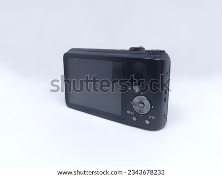 Photo of black camera, digital photo camera on a white background.
