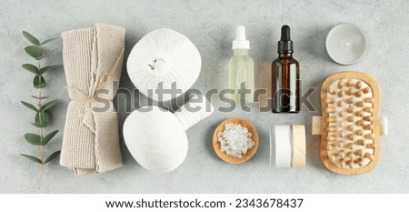 Eco friendly lifestyle concept. Top view photo of Spa set with massage herbal balls on grey background top view copy space