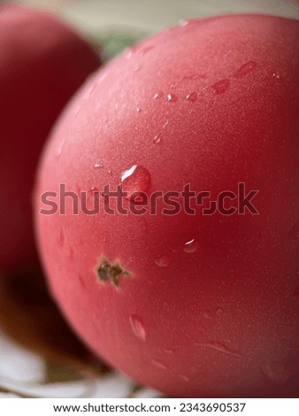 Pink tomato with water drops close-up, macro shot, not sharp focus
 Royalty-Free Stock Photo #2343690537
