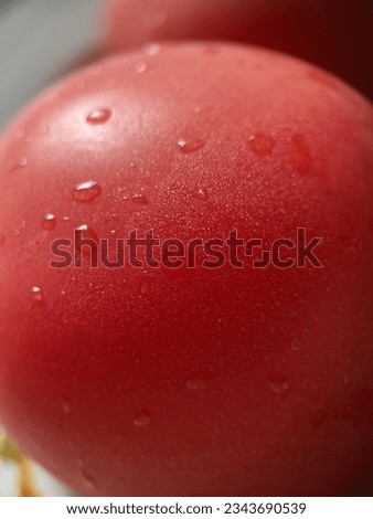 Pink tomato with water drops close-up, macro shot, not sharp focus
 Royalty-Free Stock Photo #2343690539