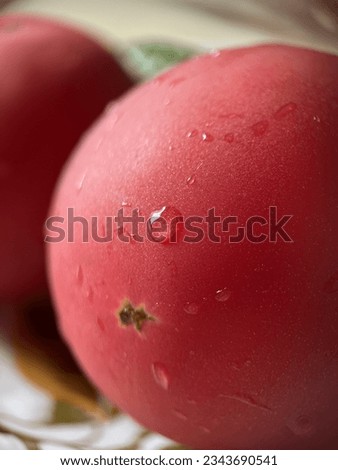 Pink tomato with water drops close-up, macro shot, not sharp focus
 Royalty-Free Stock Photo #2343690541