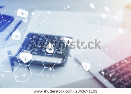 Abstract virtual medical illustration on calculator and laptop background. Medicine and healthcare concept. Multiexposure
