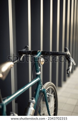 Photo of a bicycle near the wall. Street

