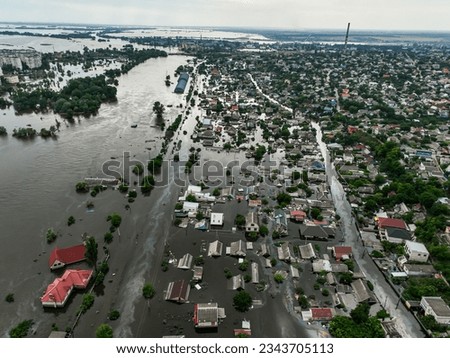 The city of Kherson, Ukraine after the explosion on the Kakhovka dam. Flooded city and streets aerial view from above. Russian-Ukrainian war. Top view Royalty-Free Stock Photo #2343705113