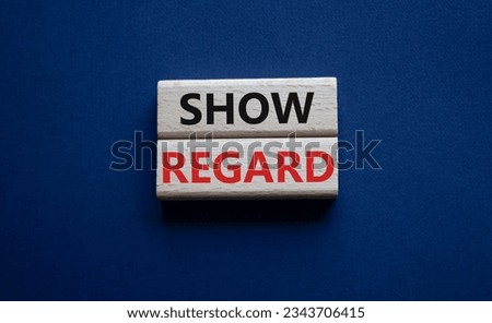 Show regard symbol. Wooden blocks with words Show regard. Beautiful deep blue background. Business and Show regard concept. Copy space. Concept word Royalty-Free Stock Photo #2343706415