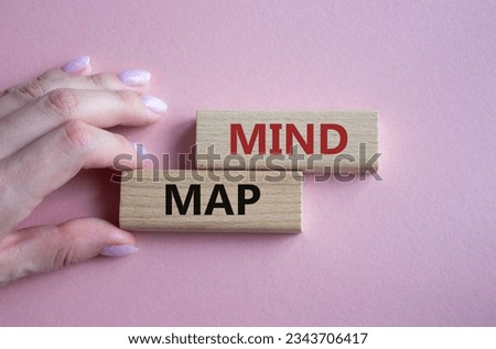 Mind Map symbol. Concept word Mind Map on wooden blocks. Businessman hand. Beautiful pink background. Business and Mind Map concept. Copy space. Concept word