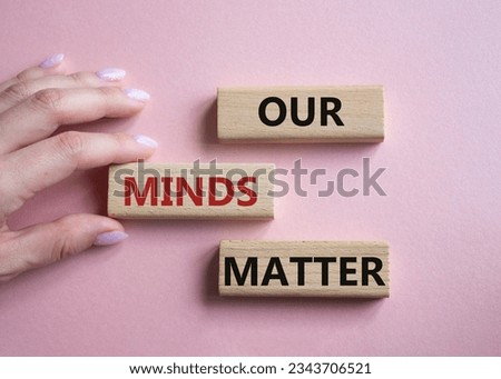 Our Minds Matter symbol. Concept words Our Minds Matter on wooden blocks. Doctor hand. Beautiful pink background. Psychological social and Our Minds Matter concept. Copy space. Concept word