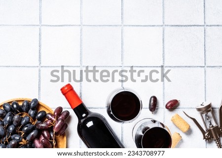 Red wine on white background.