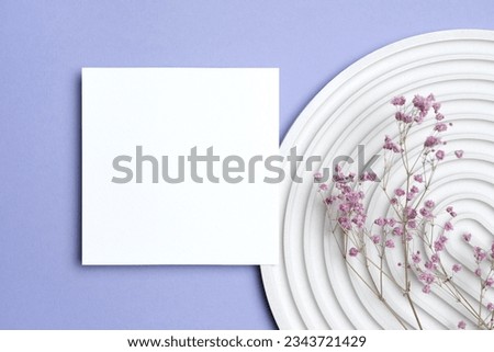 Square flyer or greeting card mockup with flowers decor, copy space for card design, top view Royalty-Free Stock Photo #2343721429