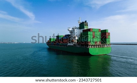 wide angle shot rear view of cargo container ship sailing in sea blue sky background to import export goods and distributing products to dealer and consumers worldwide, by container ship Transport 