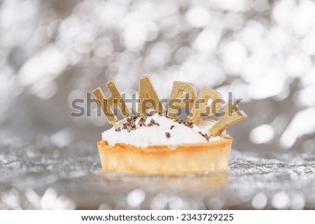 High Resolution image of a birthday cake against a white background. Representing a celebration or the healthcare industry surrounding sugar consumption. No people. 