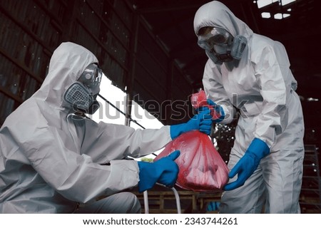 Contain Chemical Spill to Red Garbage Bags After Absorb, Part of Steps for Dealing with Chemical Spillage, Spill Cleanup Procedures, Basic Practical Training for Chemical Spill Clean-up. Royalty-Free Stock Photo #2343744261