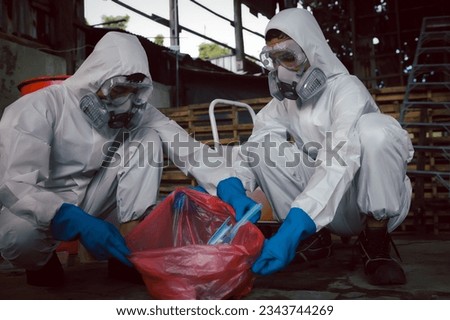 Contain Chemical Spill to Red Garbage Bags After Absorb, Part of Steps for Dealing with Chemical Spillage, Spill Cleanup Procedures, Basic Practical Training for Chemical Spill Clean-up. Royalty-Free Stock Photo #2343744269