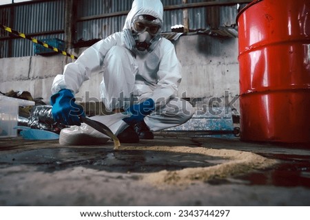 Using Sand or Sawdust to Absorbent for Oil, Acid, Chemical, Liquid Spills Cleanup. Steps for Dealing with Chemical Liquid Spillage, Part of Basic Practical Training for Chemical Spill Cleanup. Royalty-Free Stock Photo #2343744297