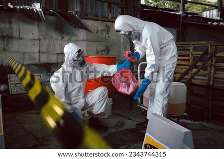 Contain Chemical Spill to Red Garbage Bags After Absorb, Part of Steps for Dealing with Chemical Spillage, Spill Cleanup Procedures, Basic Practical Training for Chemical Spill Clean-up. Royalty-Free Stock Photo #2343744315