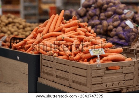 Carrot in a grocery store. Background with selective focus. Eco product. Royalty-Free Stock Photo #2343747595