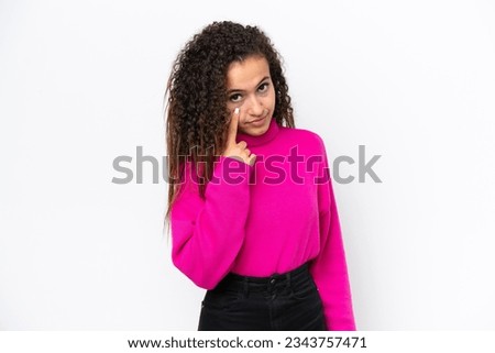 Young Arab woman isolated on white background showing something