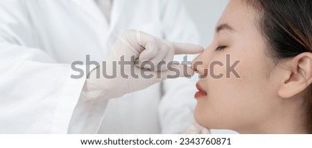 plastic surgery, beauty, Surgeon or beautician touching woman face, surgical procedure that involve altering shape of nose, doctor examines patient nose before rhinoplasty, medical assistance, health
 Royalty-Free Stock Photo #2343760871