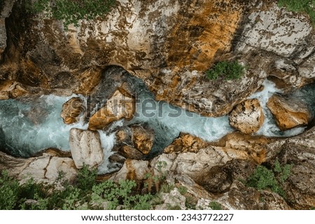 Emerald Soca River in Soca Valley, Slovenia. Aerial Drone Top Down view.Summer outdoor activities.Crystal clear water.Rafting and kayaking place in Europe.Wilderness adventure concept.Pure nature Royalty-Free Stock Photo #2343772227