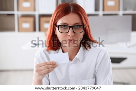 Female hand in suit give blank calling card