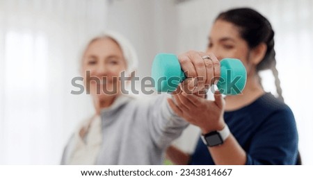 Woman, nurse and dumbbell in elderly care for physiotherapy, exercise or workout at old age home. Female doctor, caregiver or personal trainer helping senior patient in weightlifting for healthy body Royalty-Free Stock Photo #2343814667