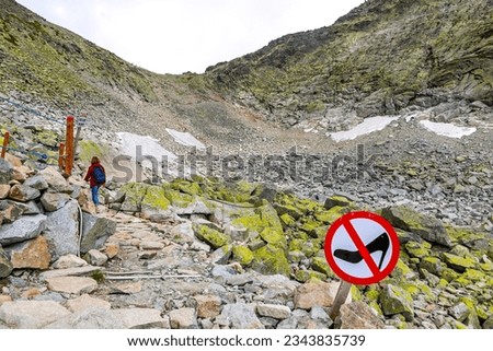 Hiking in High Tatras Mountains (Vysoke Tatry), Slovakia. No Heels Sign seen on the track to Mount Rysy (2503m)