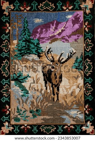Vintage picture of a deer made by cross stitch