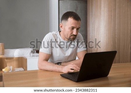work from vacation home, remote workers. man using a laptop, connecting to the Internet  at home. Working from Anywhere.
