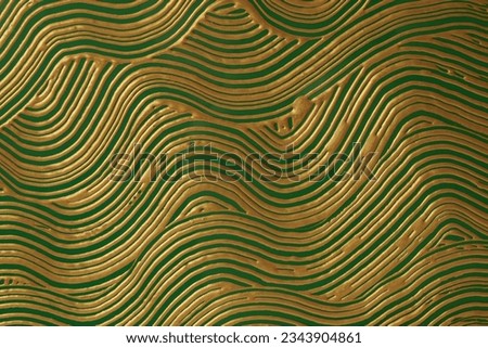 Abstract gold (bronze) and green color oil and acrylic wave painting. Canvas hand drawn grunge texture background.