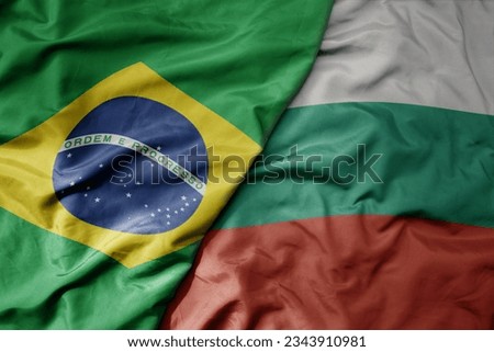 big waving realistic national colorful flag of brazil and national flag of bulgaria . macro