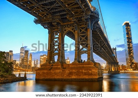 Manhattan Bridge with skyline at dusk, New York