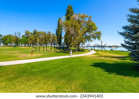 A summer day at the 24 acre lakeside Blue Heron Park in the city of Moses Lake, Washington, in Central Washington, USA. Royalty-Free Stock Photo #2343941403