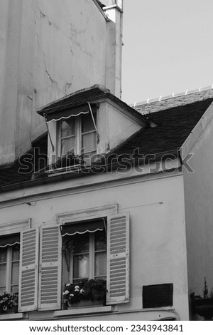 Paris, France. Mansard Roof Window of Apartment Building in Montmartre. Authentic Parisian Architecture.