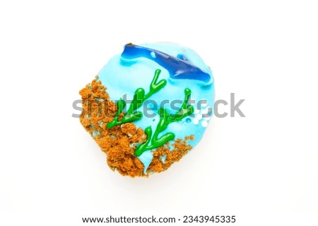 A picture of donut with art of ocean on white background. Safe the ocean awareness.