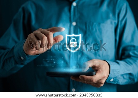 Cybersecurity and privacy data protection concept, Businessman holding smartphone and protecting secure access to user's personal data with internet network Royalty-Free Stock Photo #2343950835