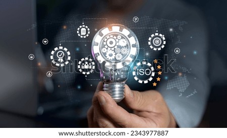 Businessman working with computer service. Quality assurance. Warranty. Standard. Quality control concept, ISO standard, warranty on dark background. The concept of cogs and gear wheel mechanisms. Royalty-Free Stock Photo #2343977887