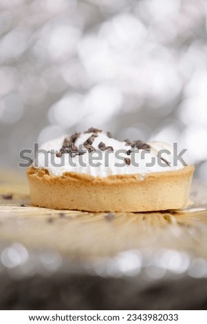 High Resolution image of a small birthday cake against a silver background. Representing a celebration or the healthcare industry surrounding sugar consumption. No people. 