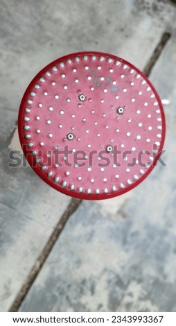 red round metal plate as outdoor fitness equipment in the park