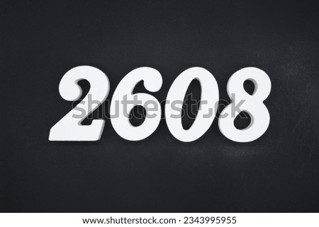 Black for the background. The number 2608 is made of white painted wood.