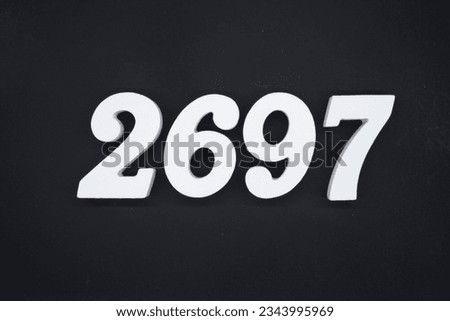 Black for the background. The number 2697 is made of white painted wood.