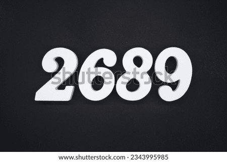 Black for the background. The number 2689 is made of white painted wood.