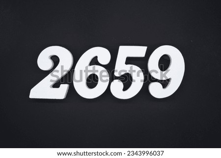 Black for the background. The number 2659 is made of white painted wood.