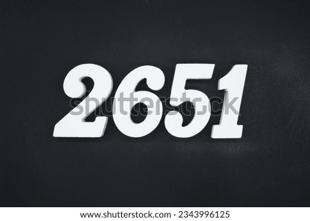 Black for the background. The number 2651 is made of white painted wood.