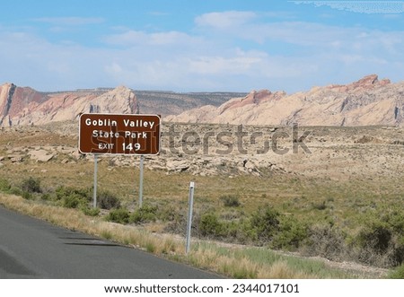 Brown road sign for Goblin Valley State Park exit off of Utah Highway 24 scenic byway